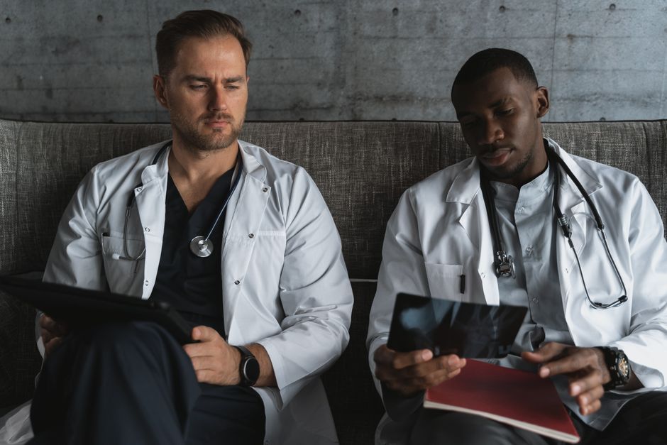 emergency medicine specialist reviewing clinical charts and diagnostic scans